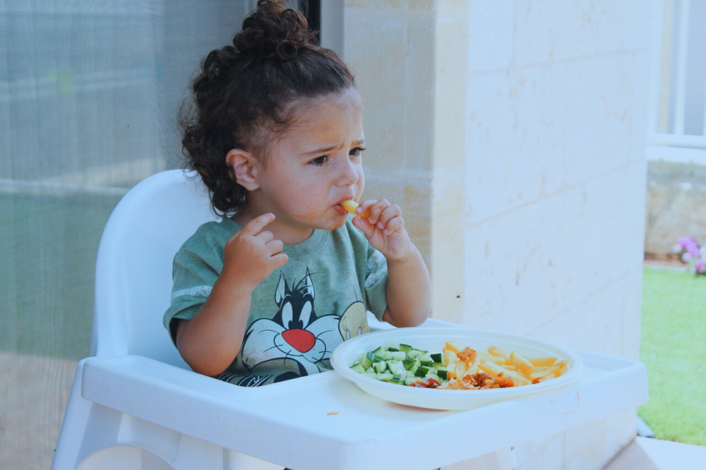 a kid eating a meal